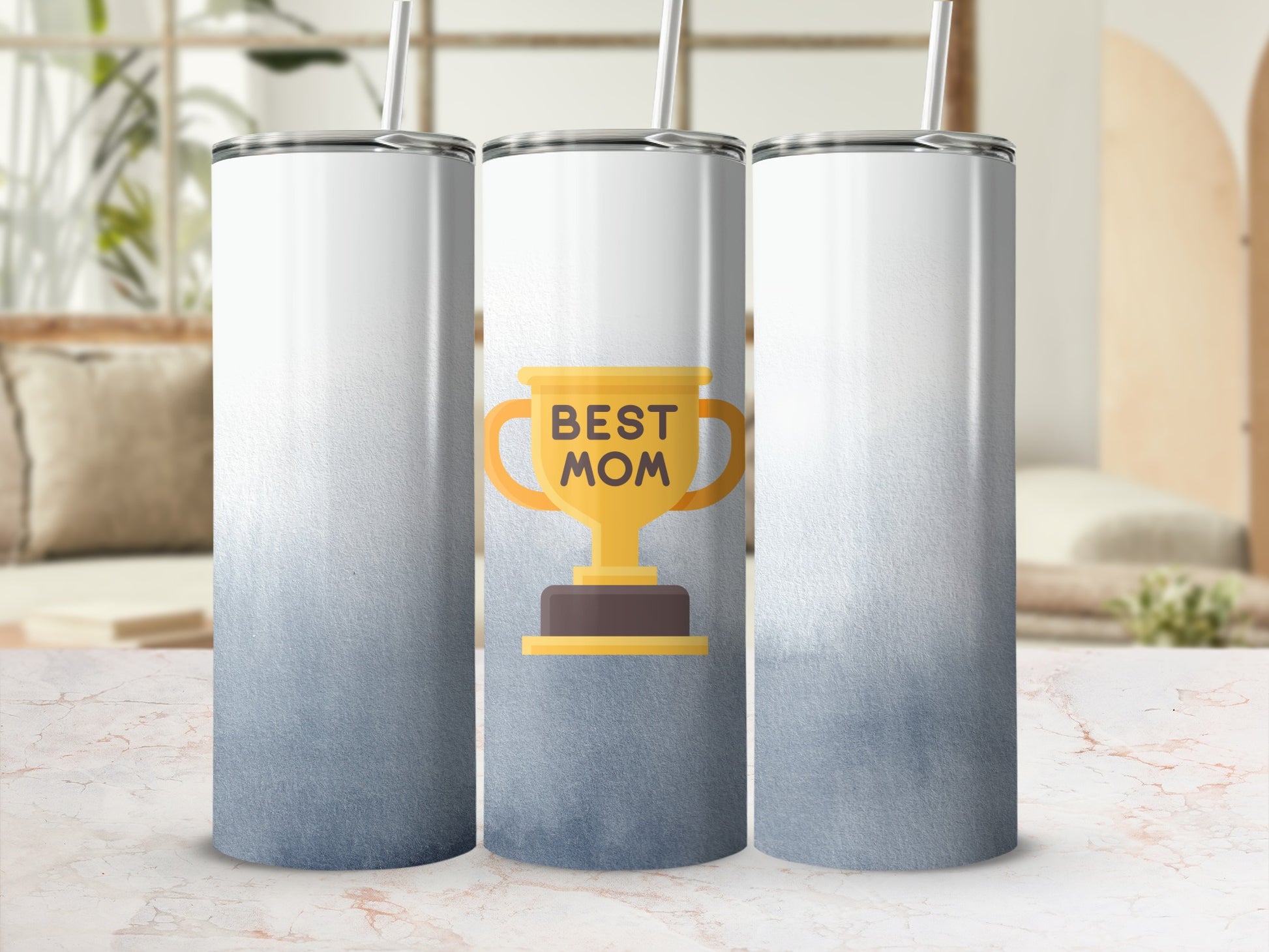 Trophy graphic with "BEST MOM" text on a blue gradient skinny tumbler.