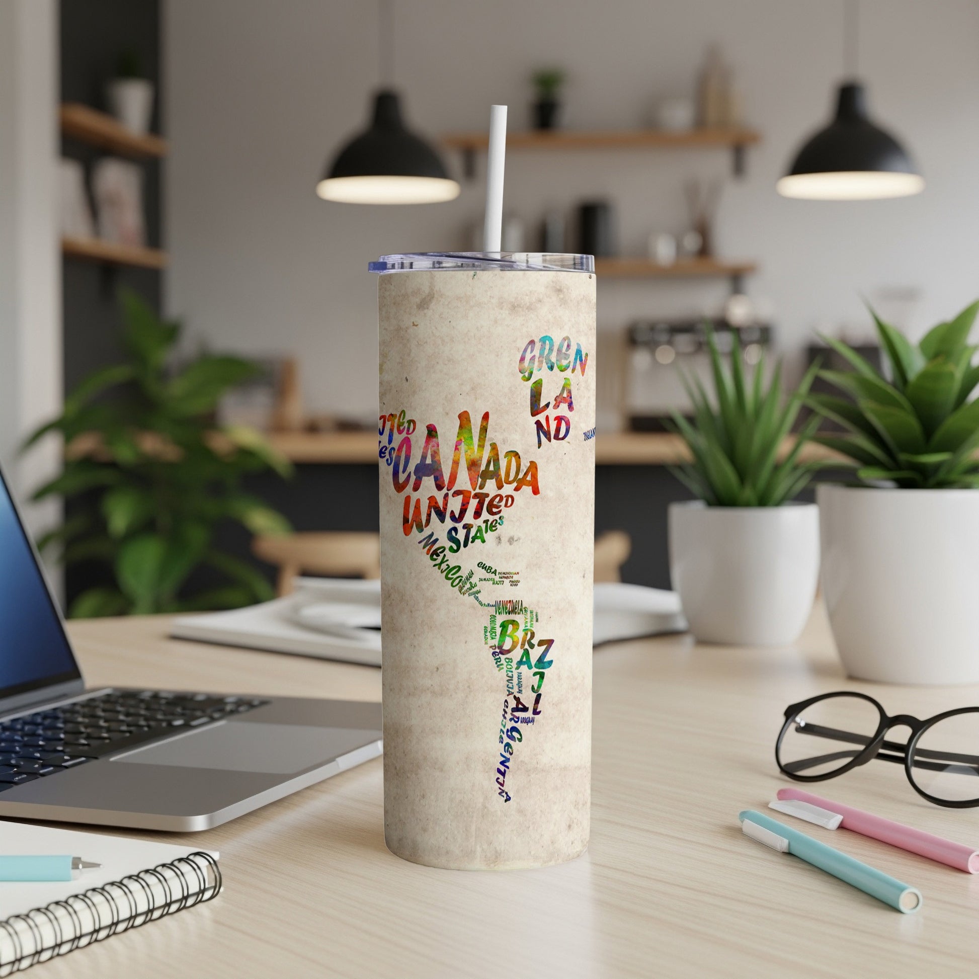 Tumbler with colorful map of North and South America made of country names.