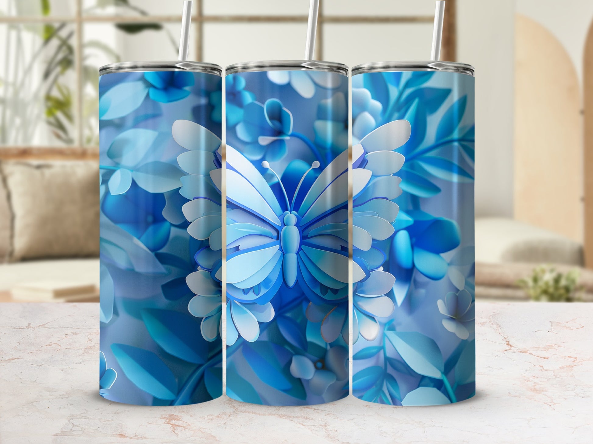 Blue butterfly and floral design on three tumblers.