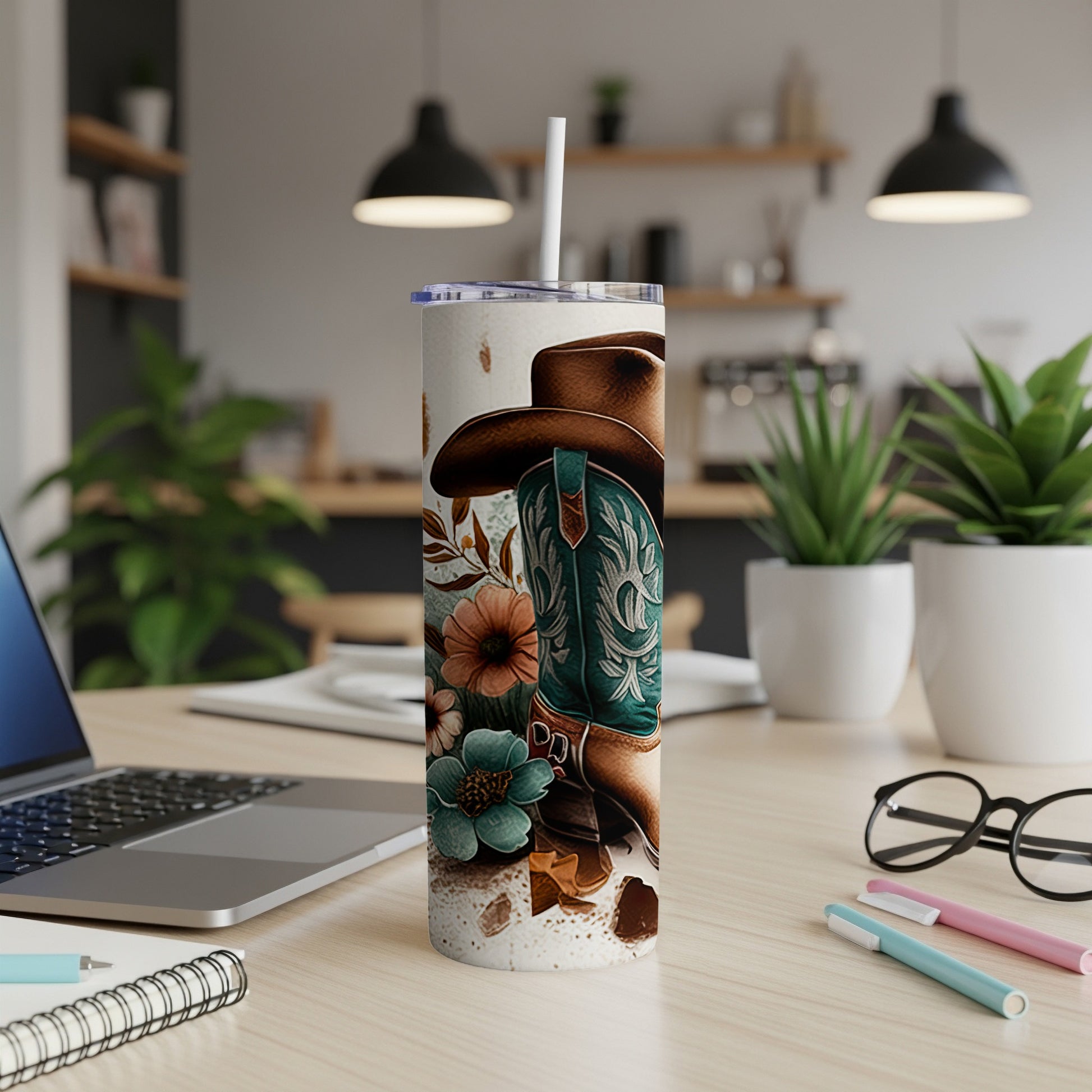 Cowboy boots and hat with floral accents on a tumbler.