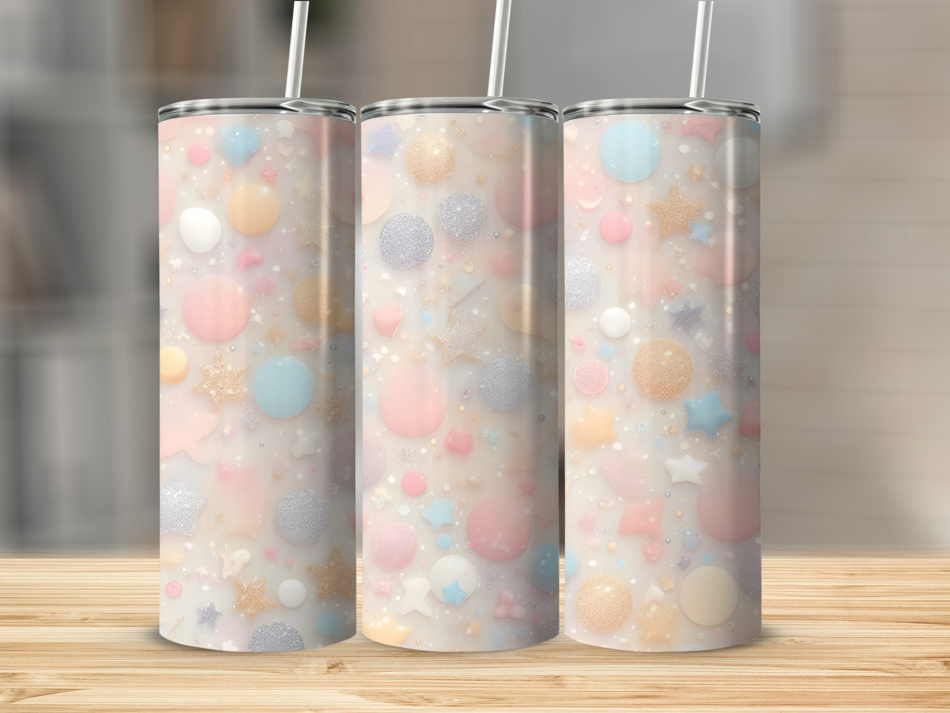 Three pastel tumblers with a confetti pattern of stars, circles, and glitter.