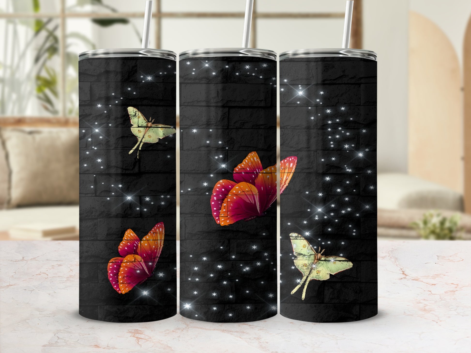 Three tumblers with a black brick pattern and glowing butterflies.
