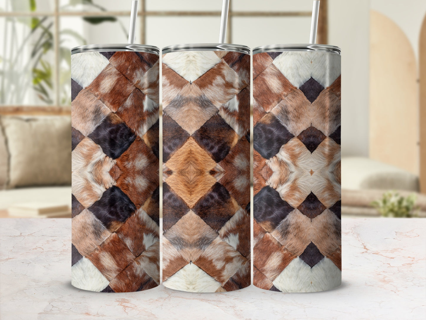 Three patterned tumblers with diamond-shaped fur texture on a marble surface.