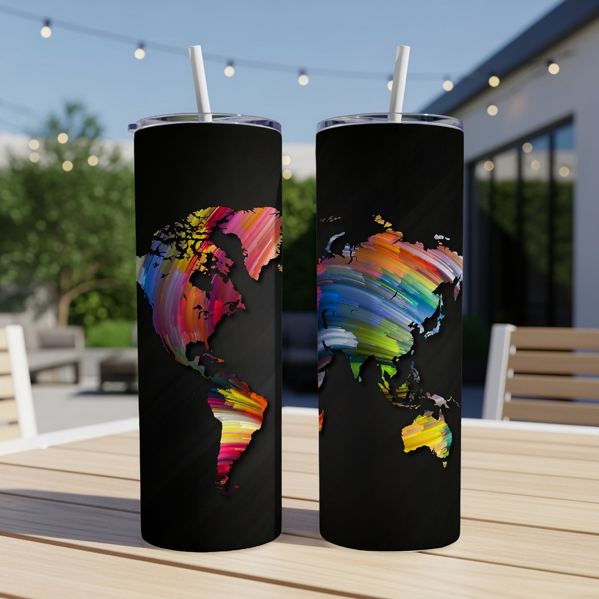 Two black tumblers with colorful, abstract world map designs and white straws.
