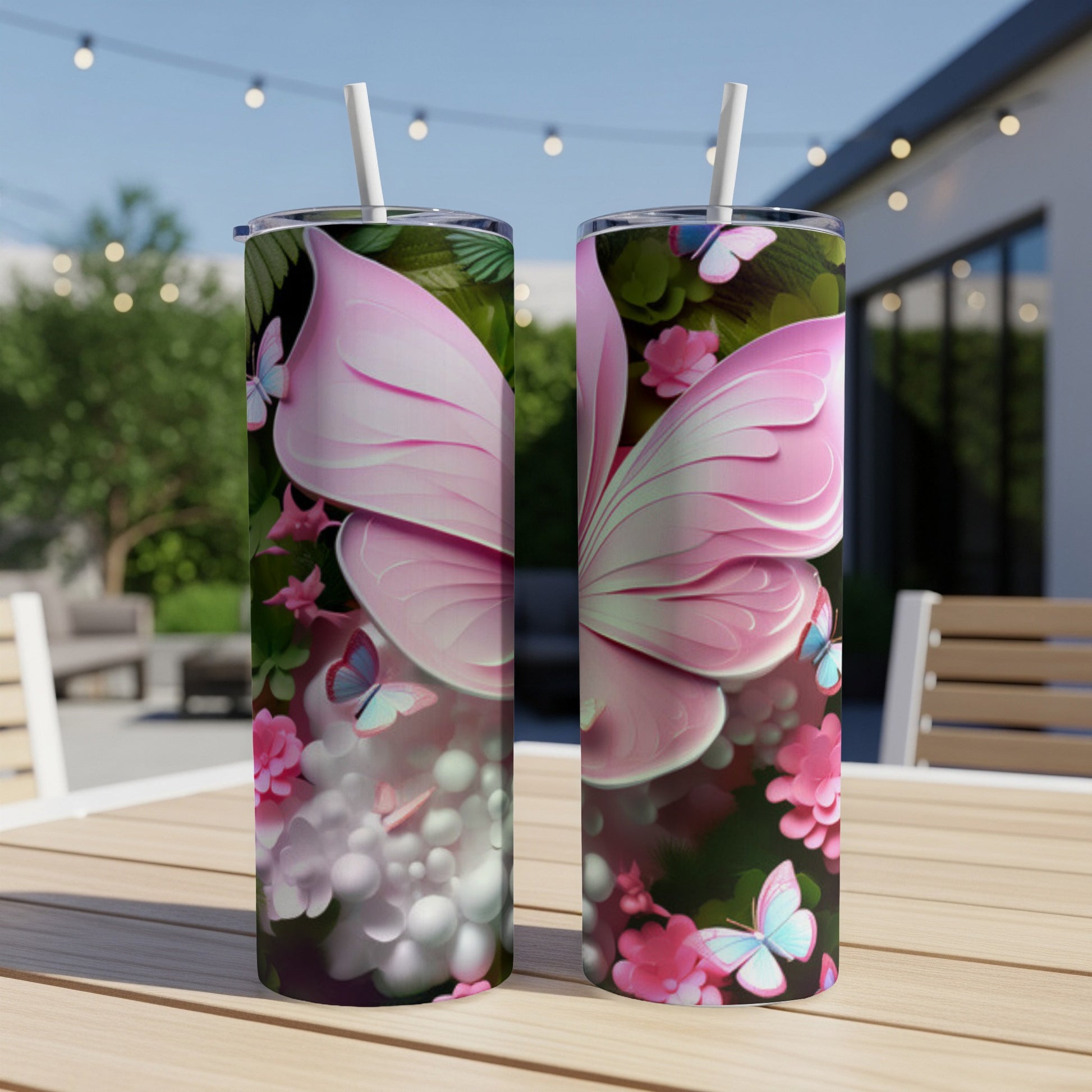 Two pink butterfly wing tumblers with floral and butterfly accents.