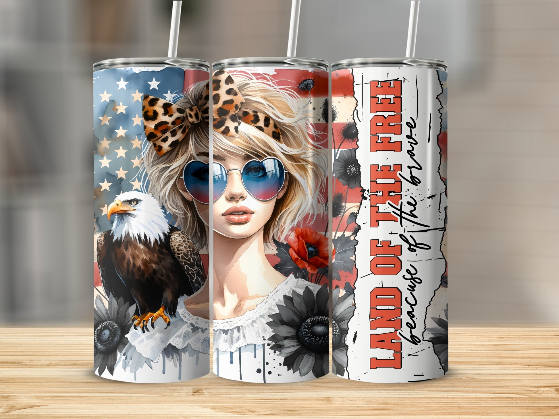 Patriotic tumbler with eagle, woman, flowers, and "Land of the Free" text.