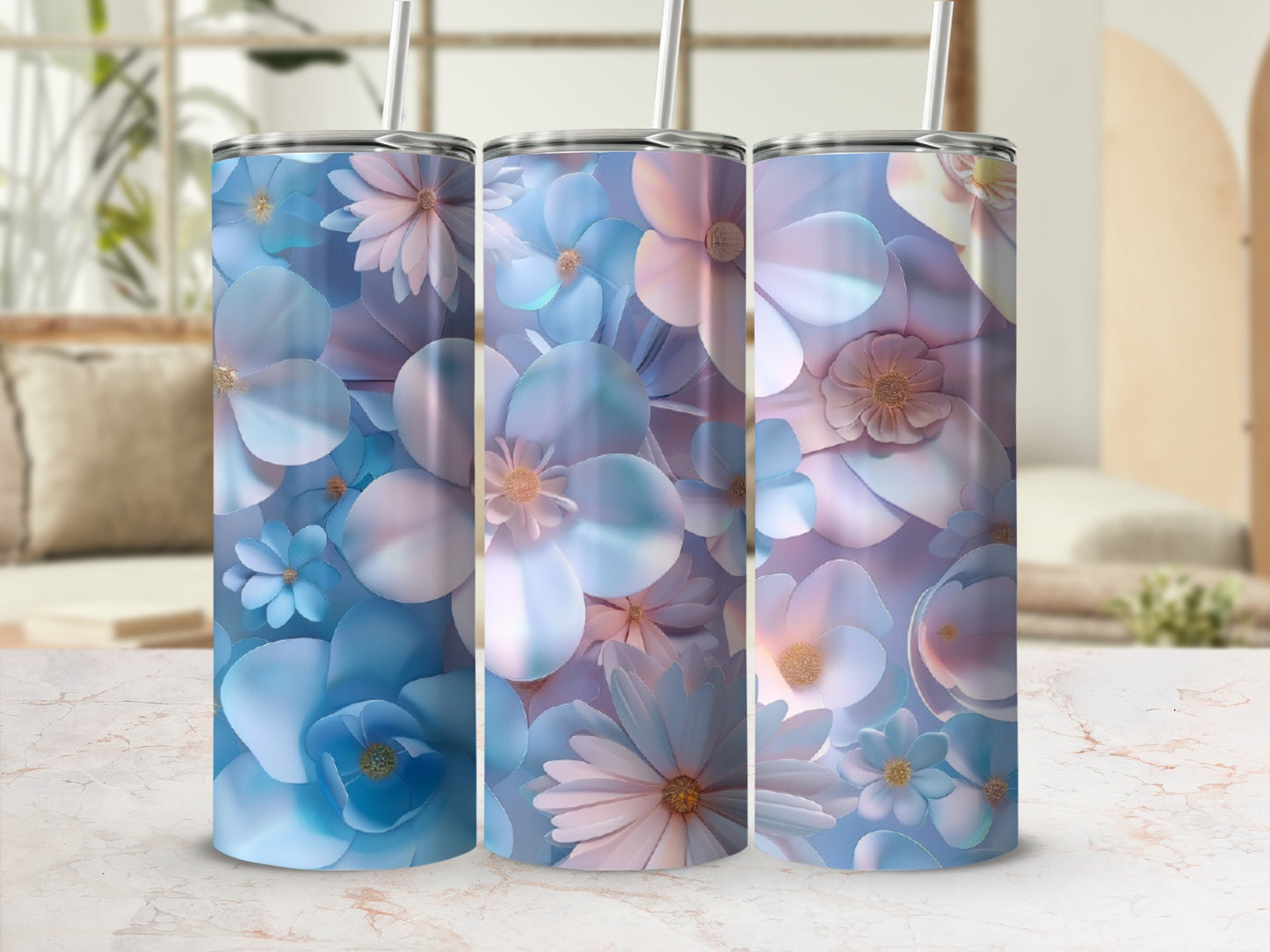 Three tumblers adorned with blue and pink pastel floral designs.