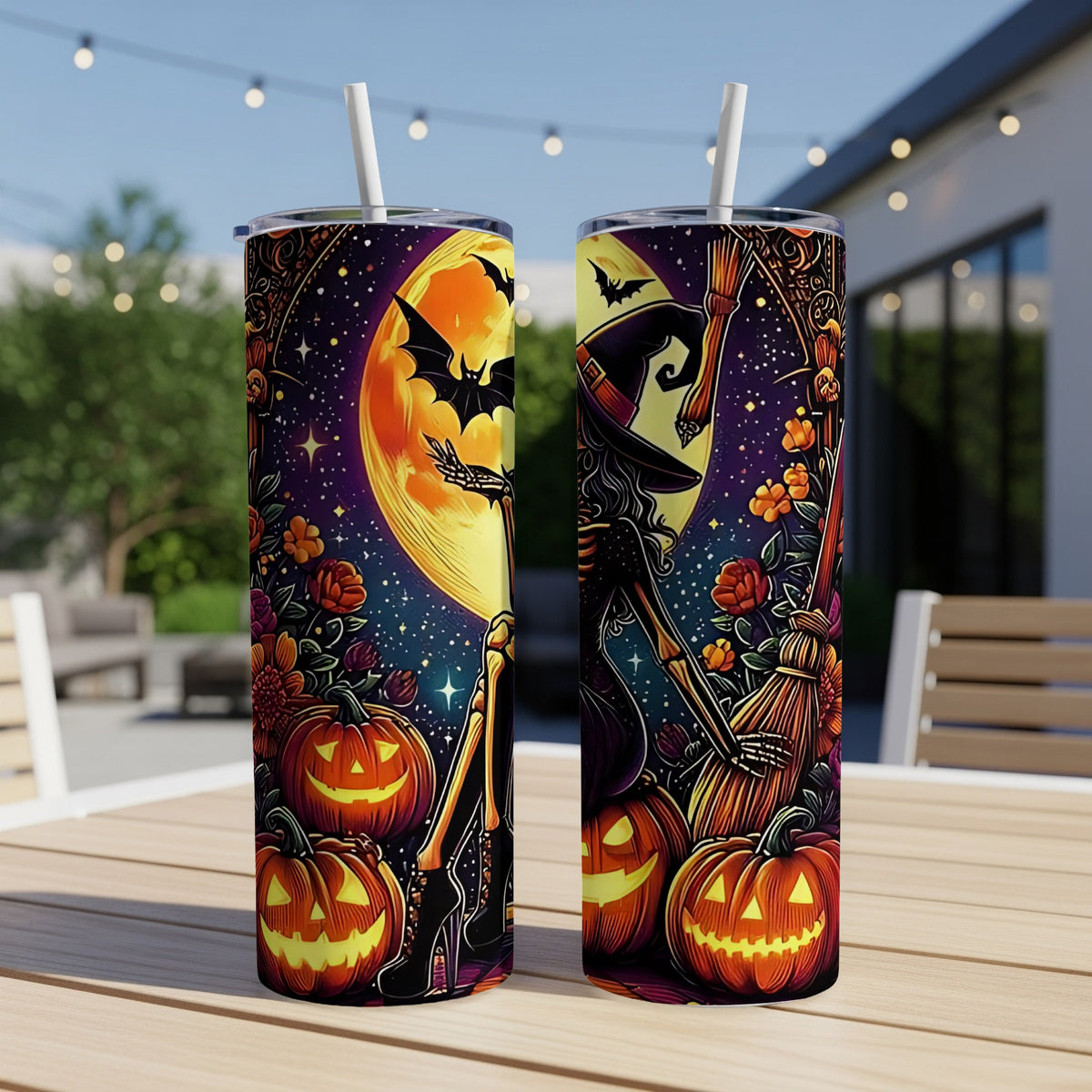 Two Halloween-themed tumblers with skeletons, pumpkins, bats, and a witch's hat.