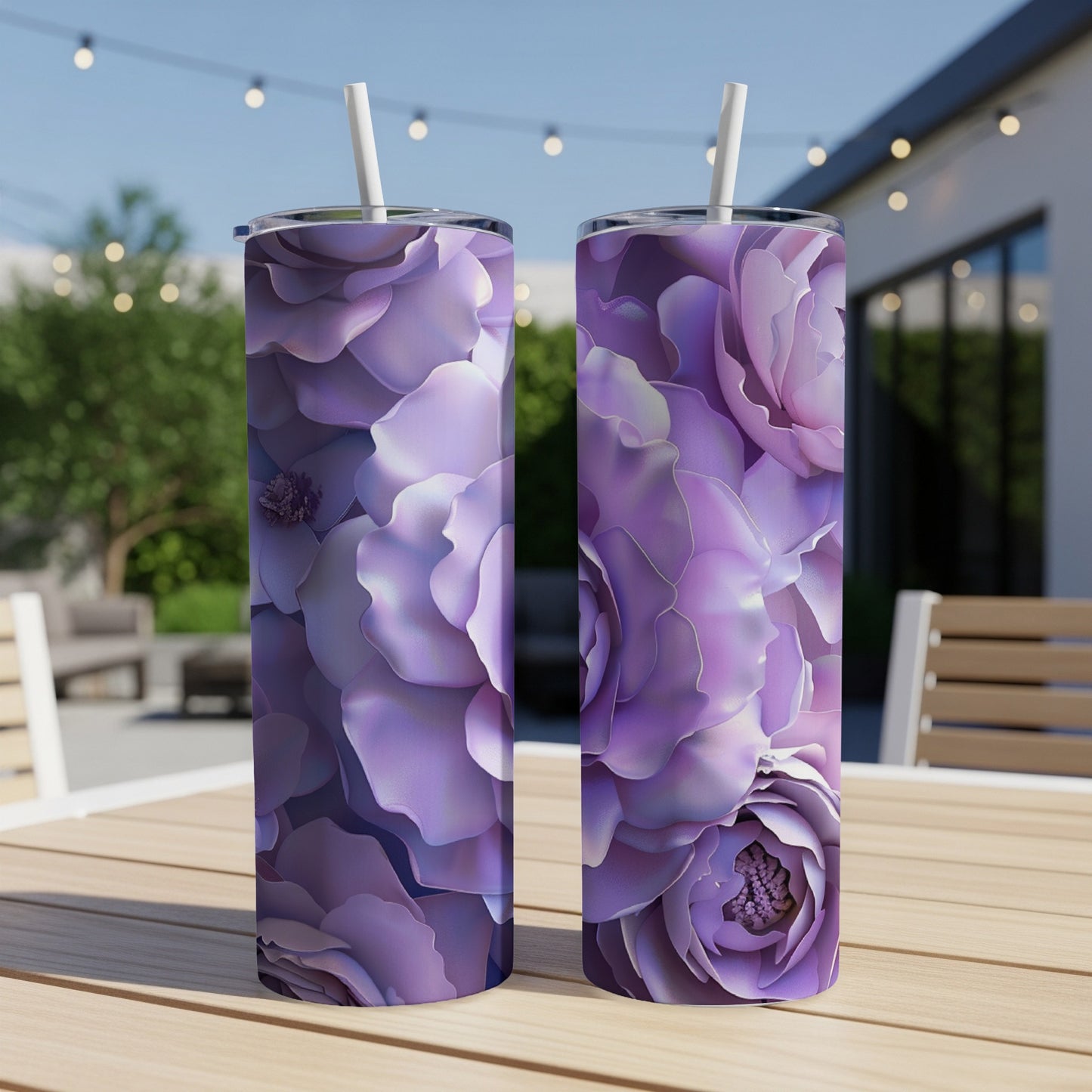 Two tall tumblers with a purple floral pattern on a wooden table.