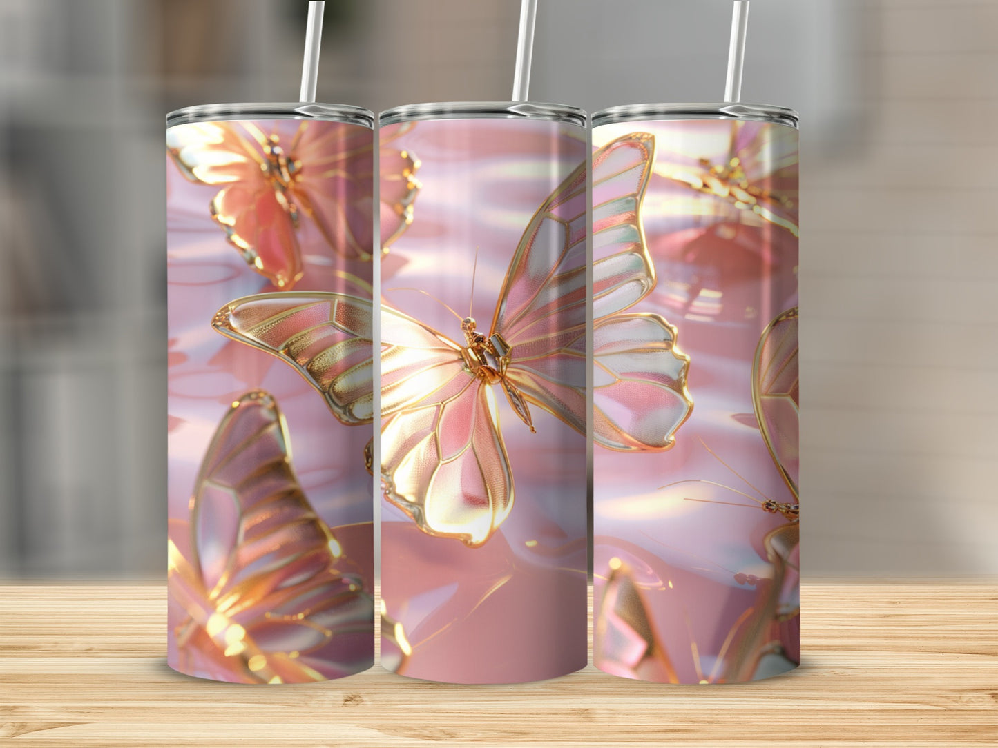 Pink and gold butterflies on a shimmering pink background on three tumblers.