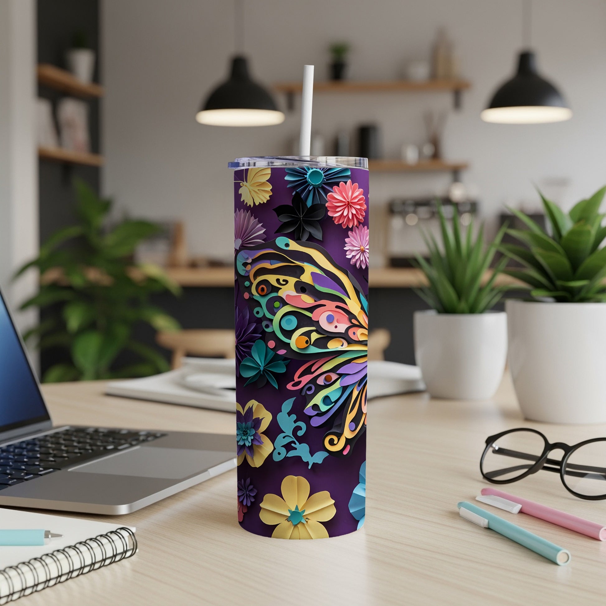 Purple tumbler with colorful butterfly and floral design, featuring a straw.
