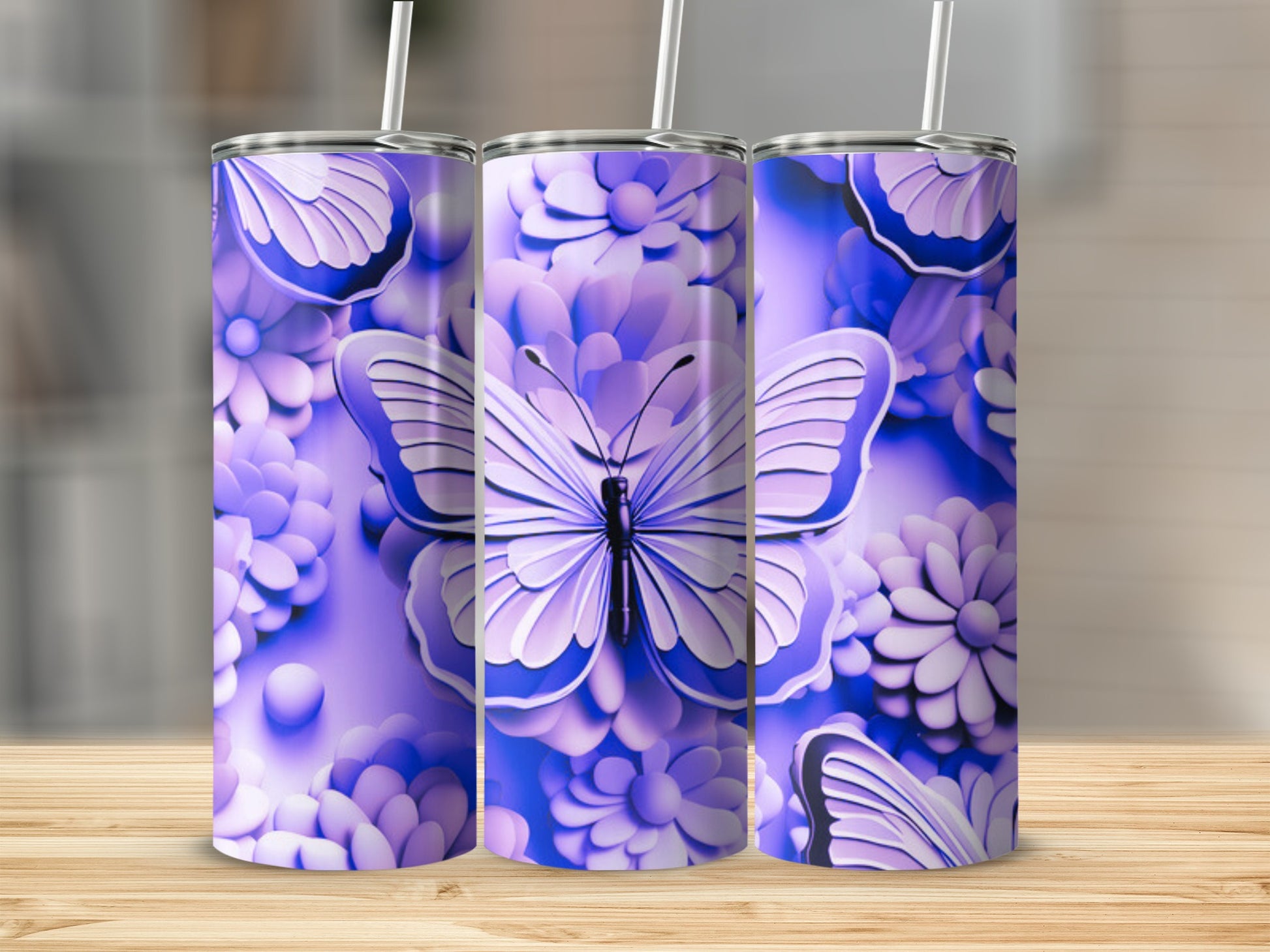 Purple butterfly and floral design on three slim tumblers.