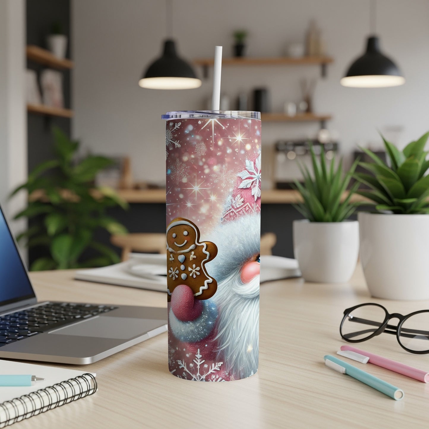Santa Claus and gingerbread man design on a skinny tumbler with a straw.