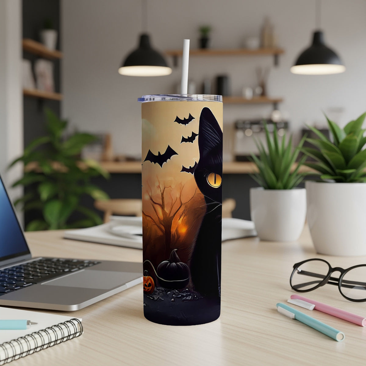 Black cat Halloween tumbler with bats, pumpkins, and a spooky forest scene.