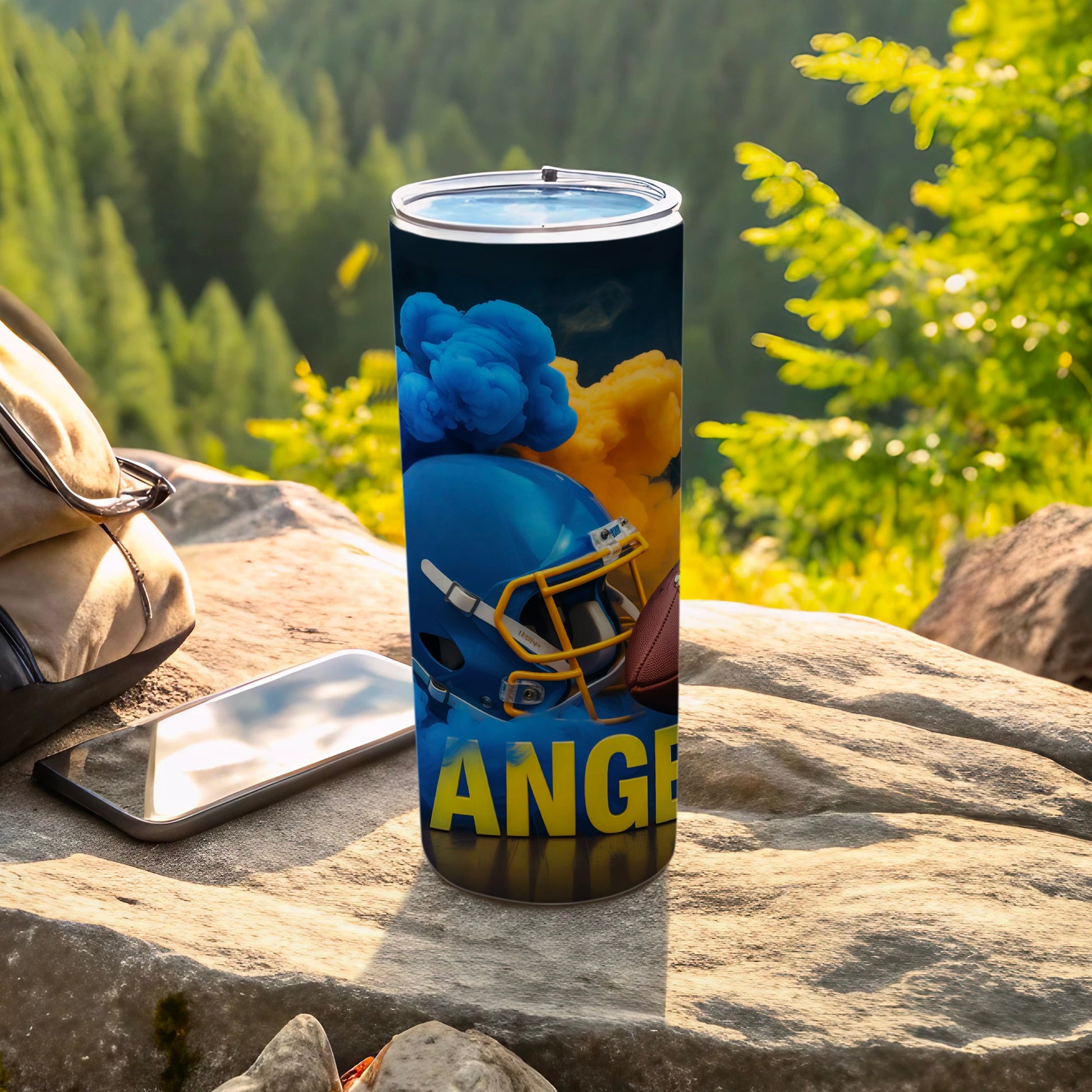 Blue and yellow smoke swirling around a football helmet and ball on a tumbler.