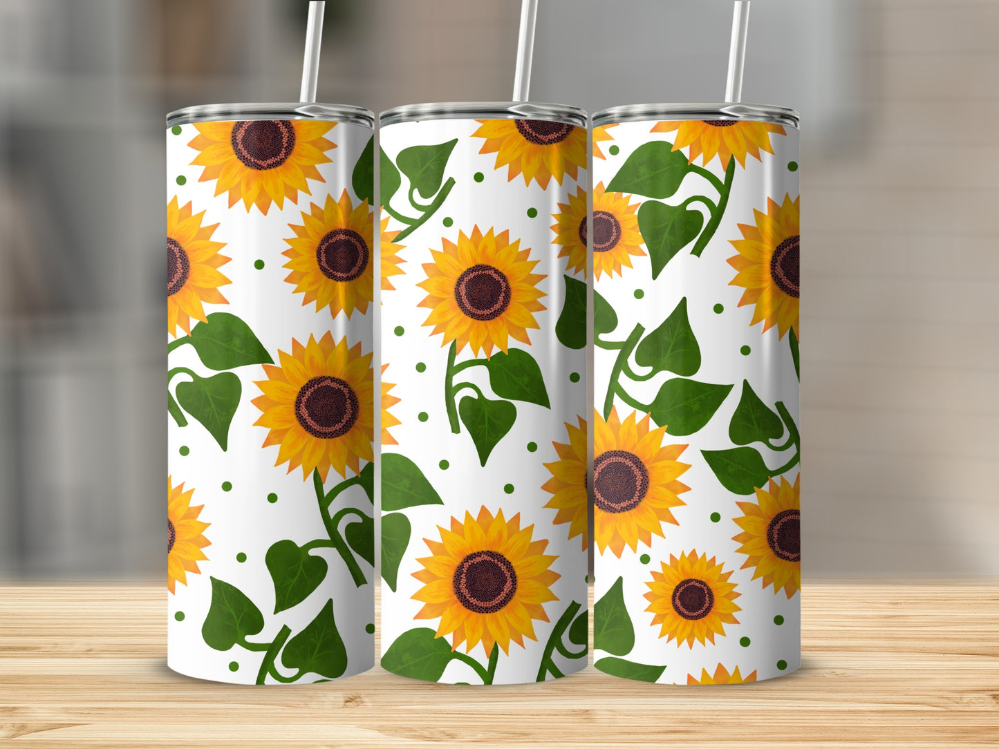 Three tumblers with a repeating sunflower and leaf pattern.