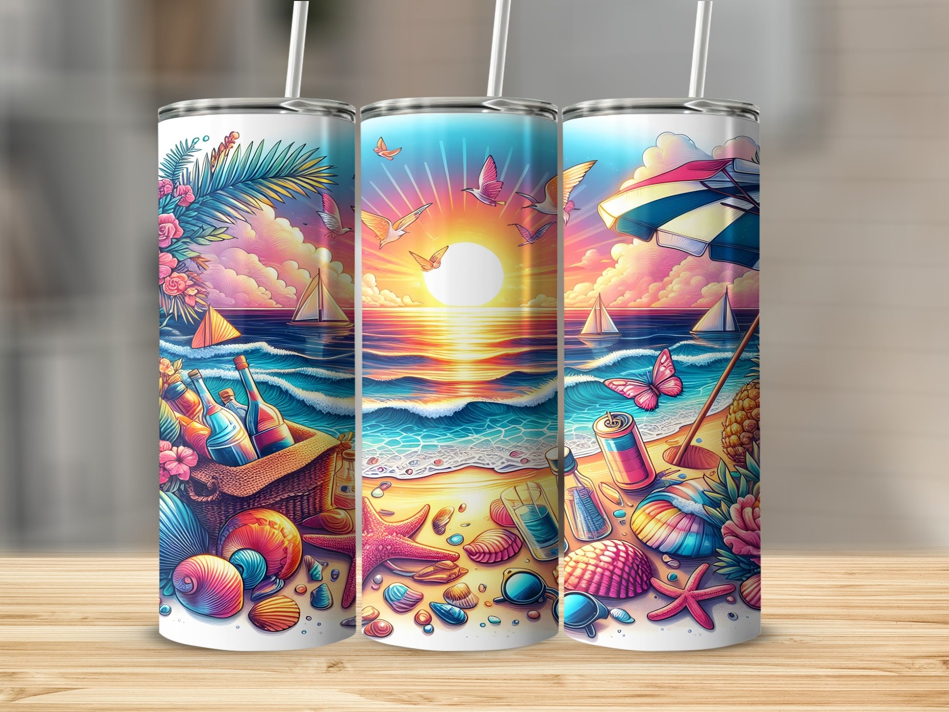 Three tumblers with a beach scene, sunset, and seashells.