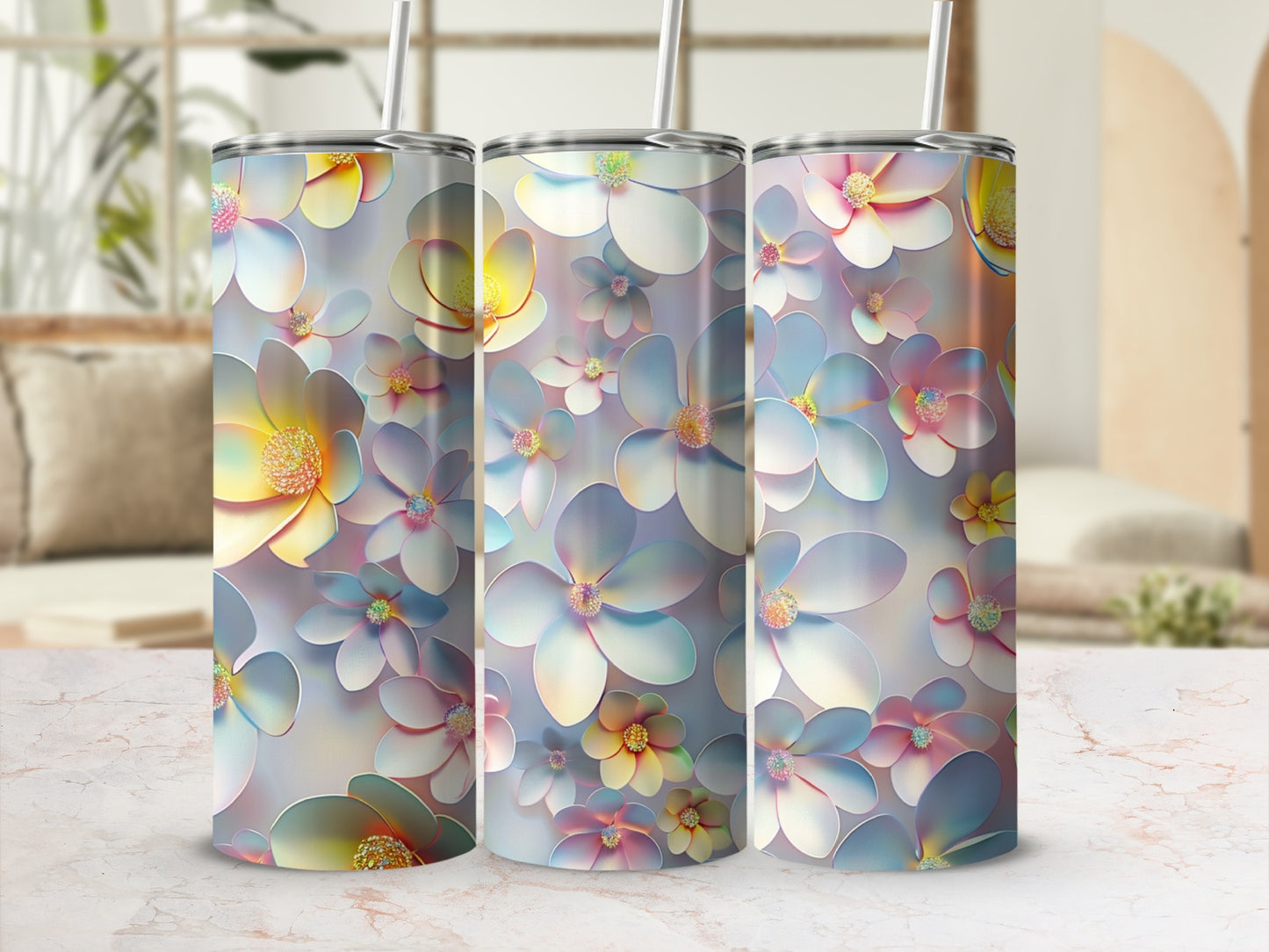 Three tumblers with a floral pattern in soft pastel colors.