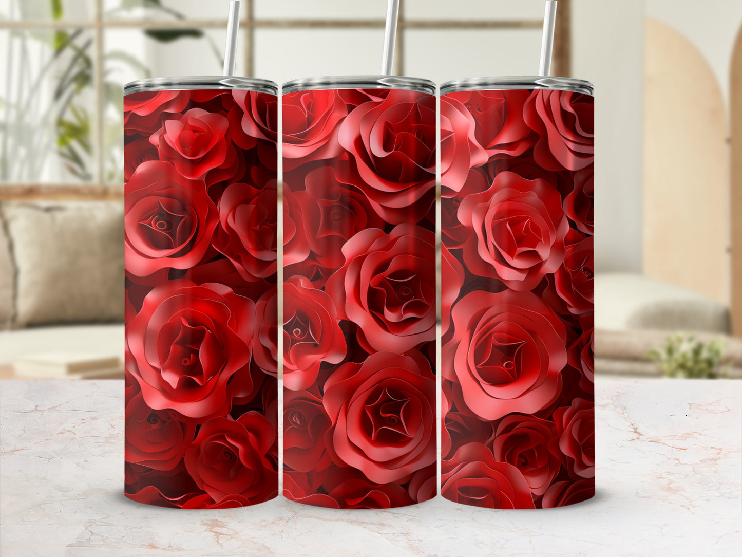 Three tumblers with a dark red rose pattern on a marble surface.