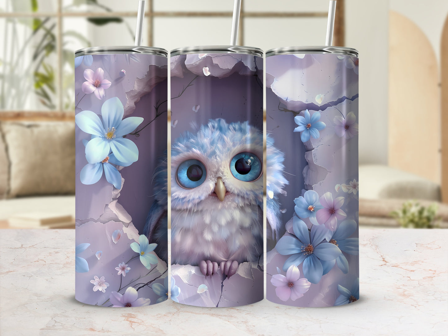 Three tumblers decorated with a fluffy baby owl among purple and blue flowers.