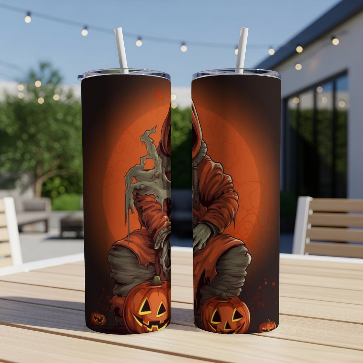 Two tumblers featuring a spooky Halloween character holding a bone with jack-o'-lanterns.