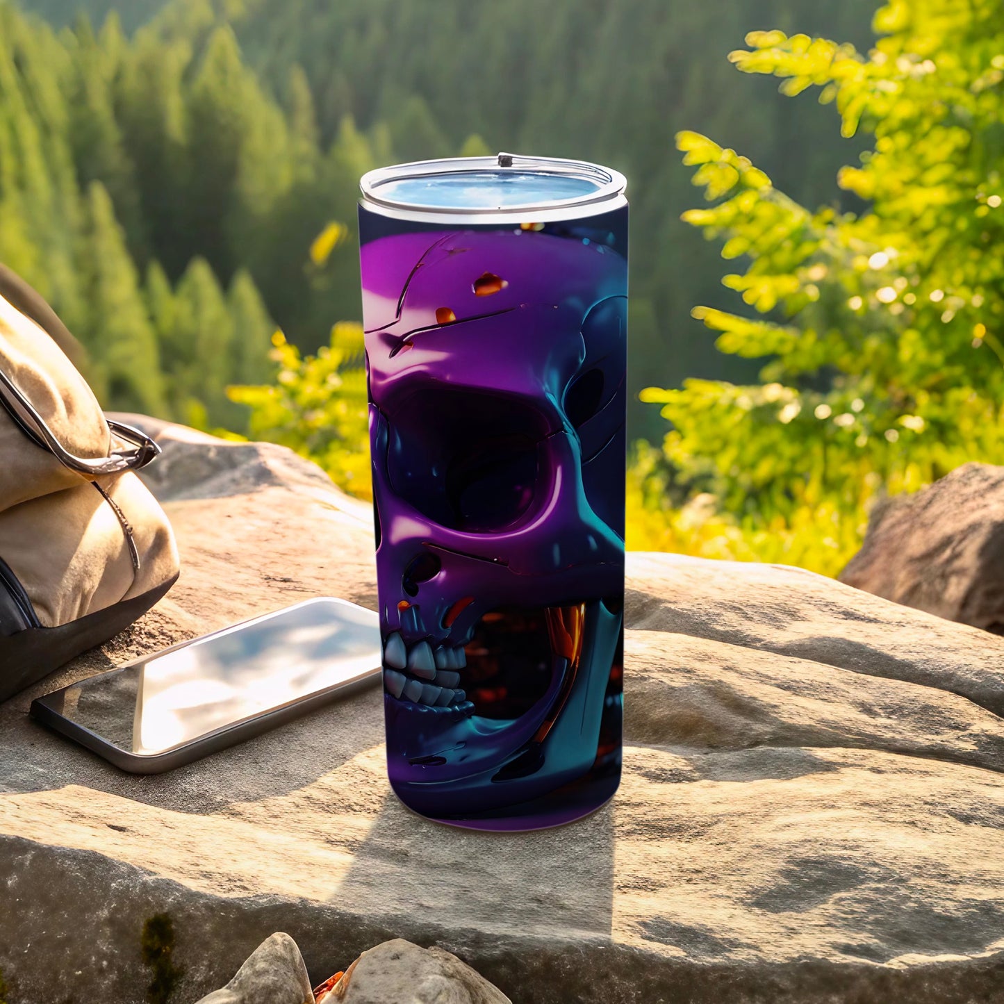 Purple metallic skull tumbler with phone and bag outdoors.