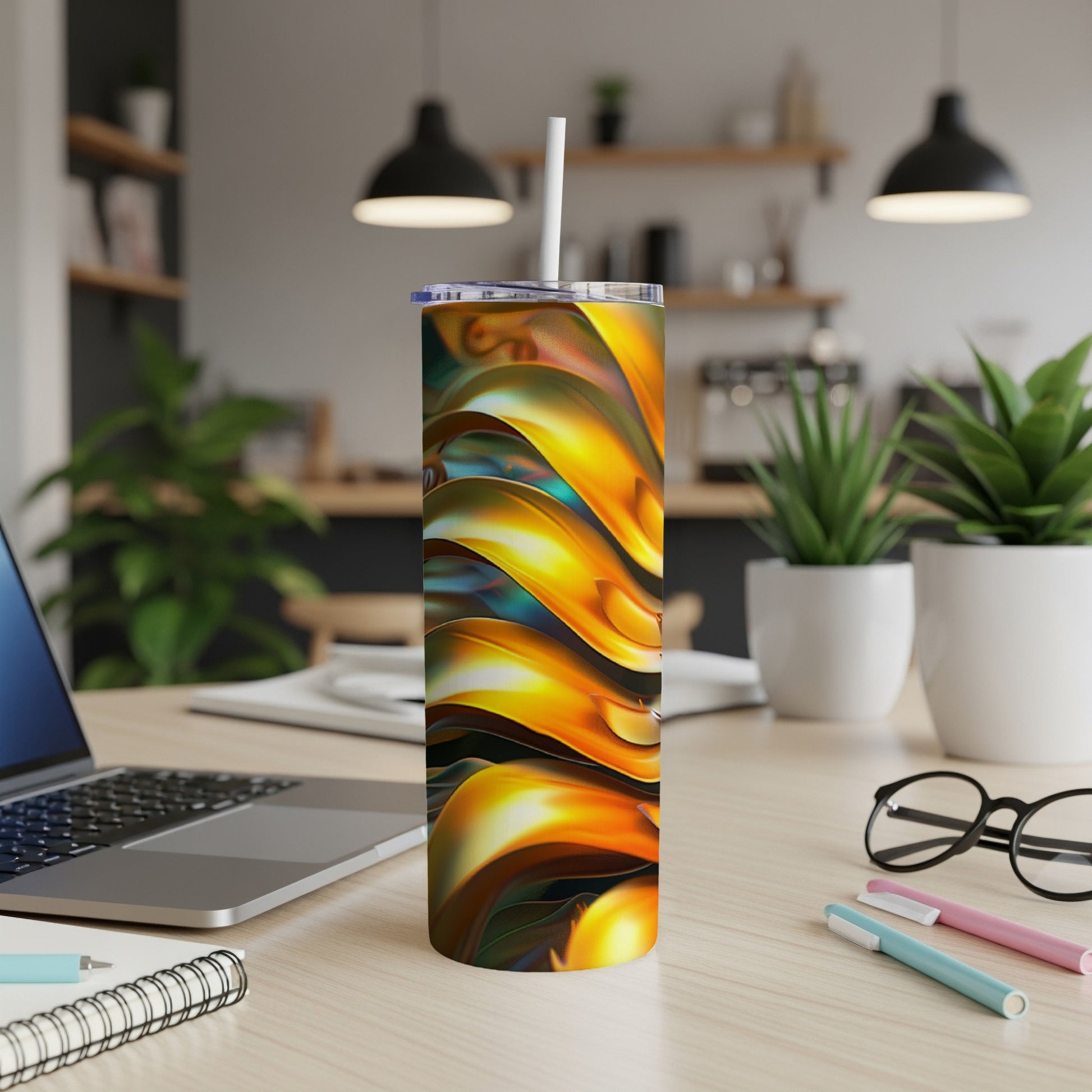 Abstract wavy gold and blue pattern on a white tumbler with straw.