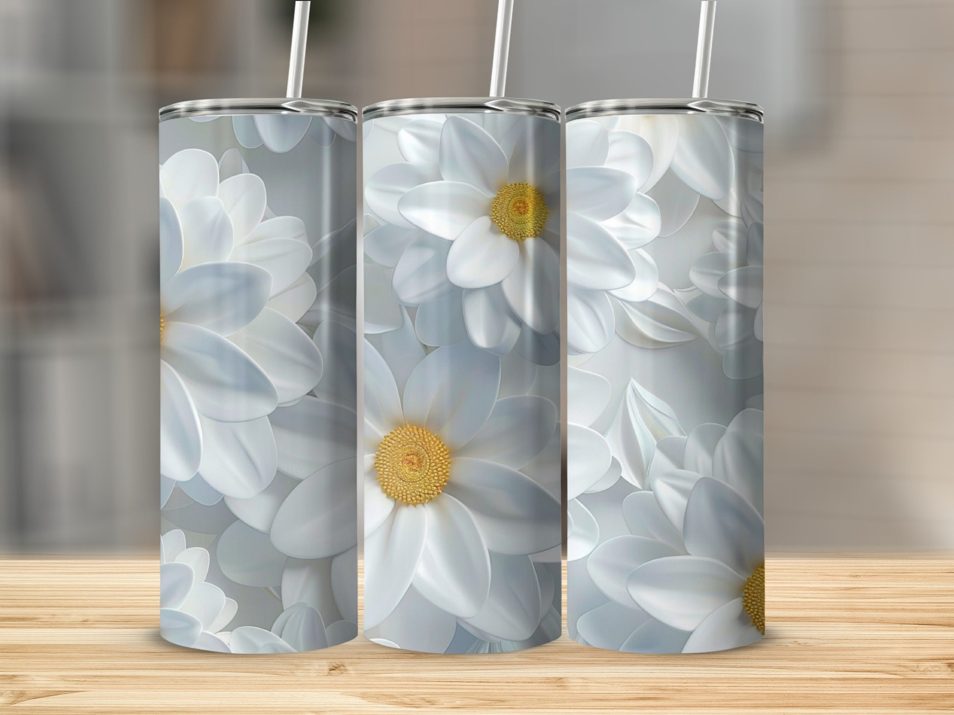 Three tumblers with white daisy floral pattern.