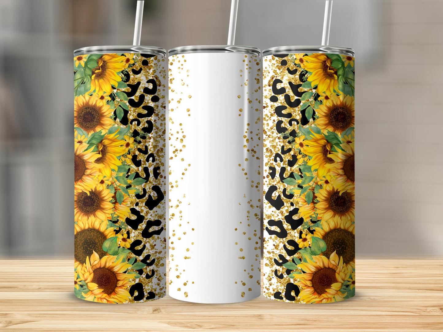 Three tumblers with sunflowers and leopard print on a wooden surface.