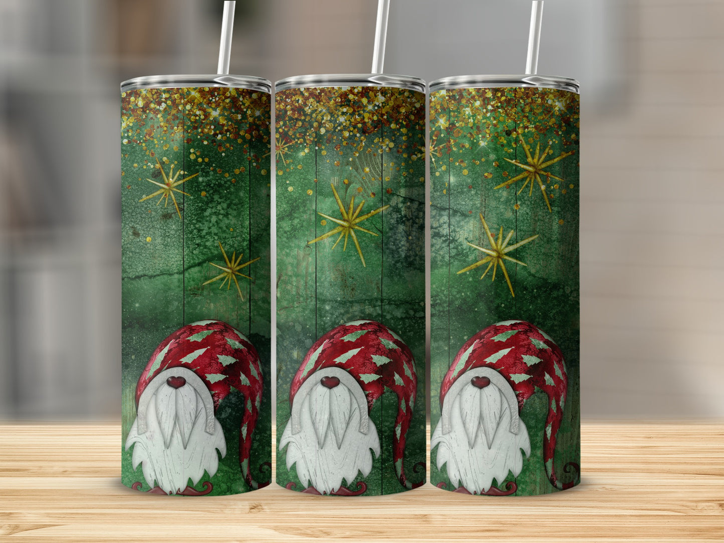 Three tumblers featuring a green, textured background with gold stars and gnomes.