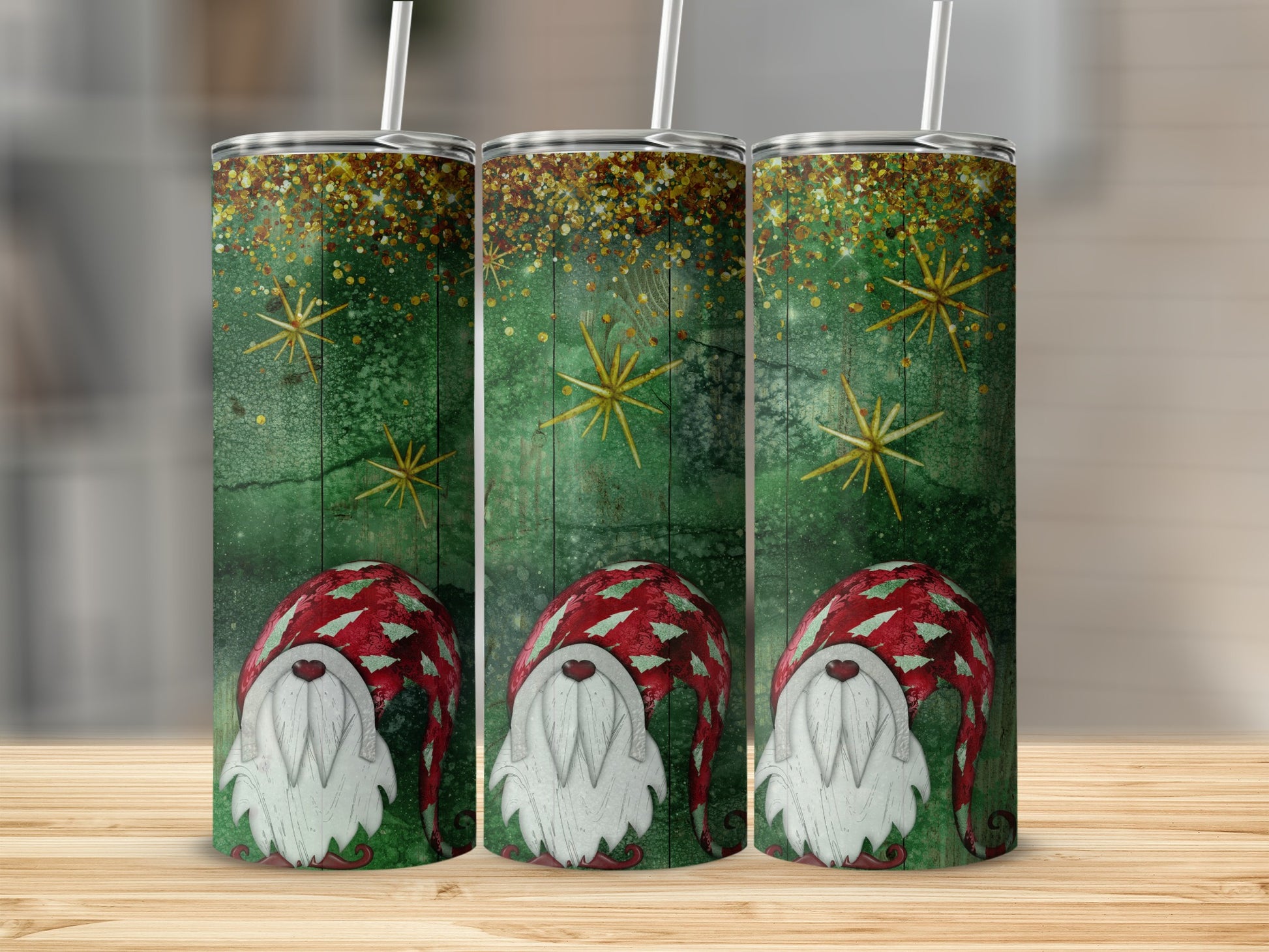 Three tumblers featuring a green, textured background with gold stars and gnomes.