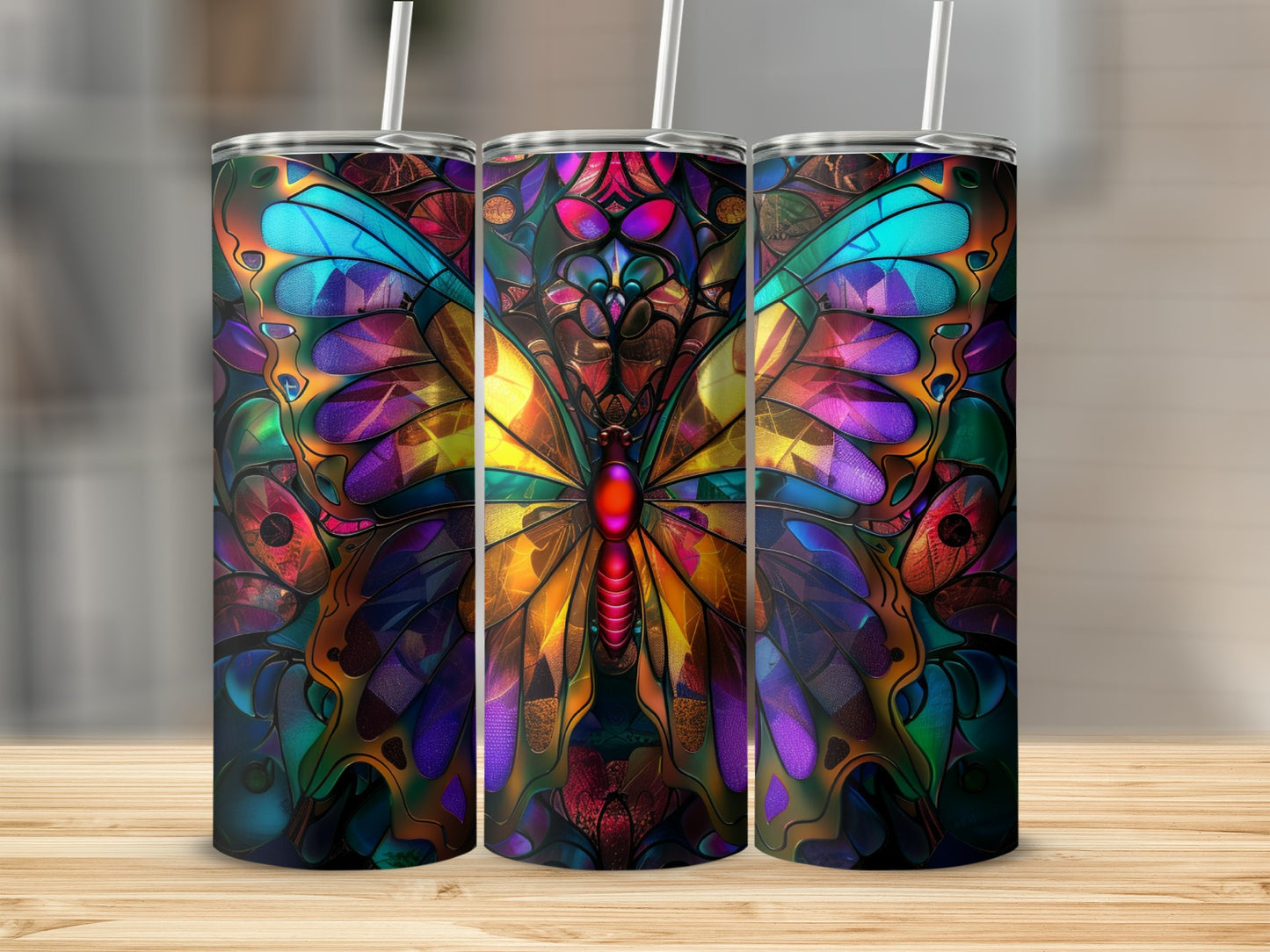 Triptych of tumblers with stained glass butterfly and floral patterns.