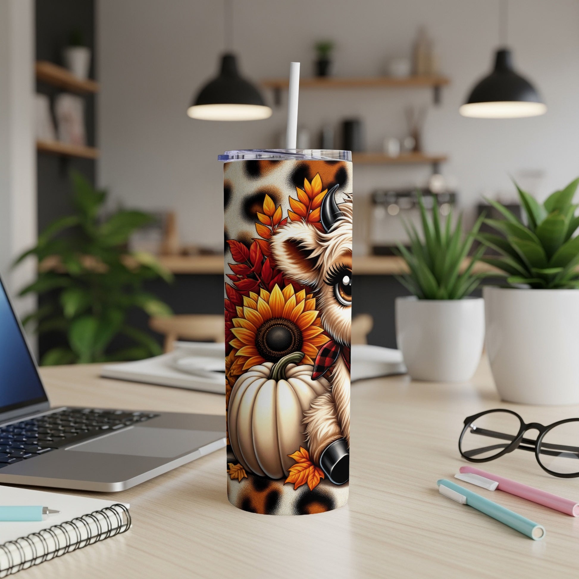 Cow with pumpkin, sunflowers, and autumn leaves on a tumbler.