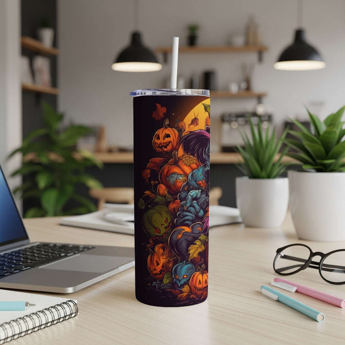 Tumbler with a Halloween-themed design featuring pumpkins and spooky creatures.