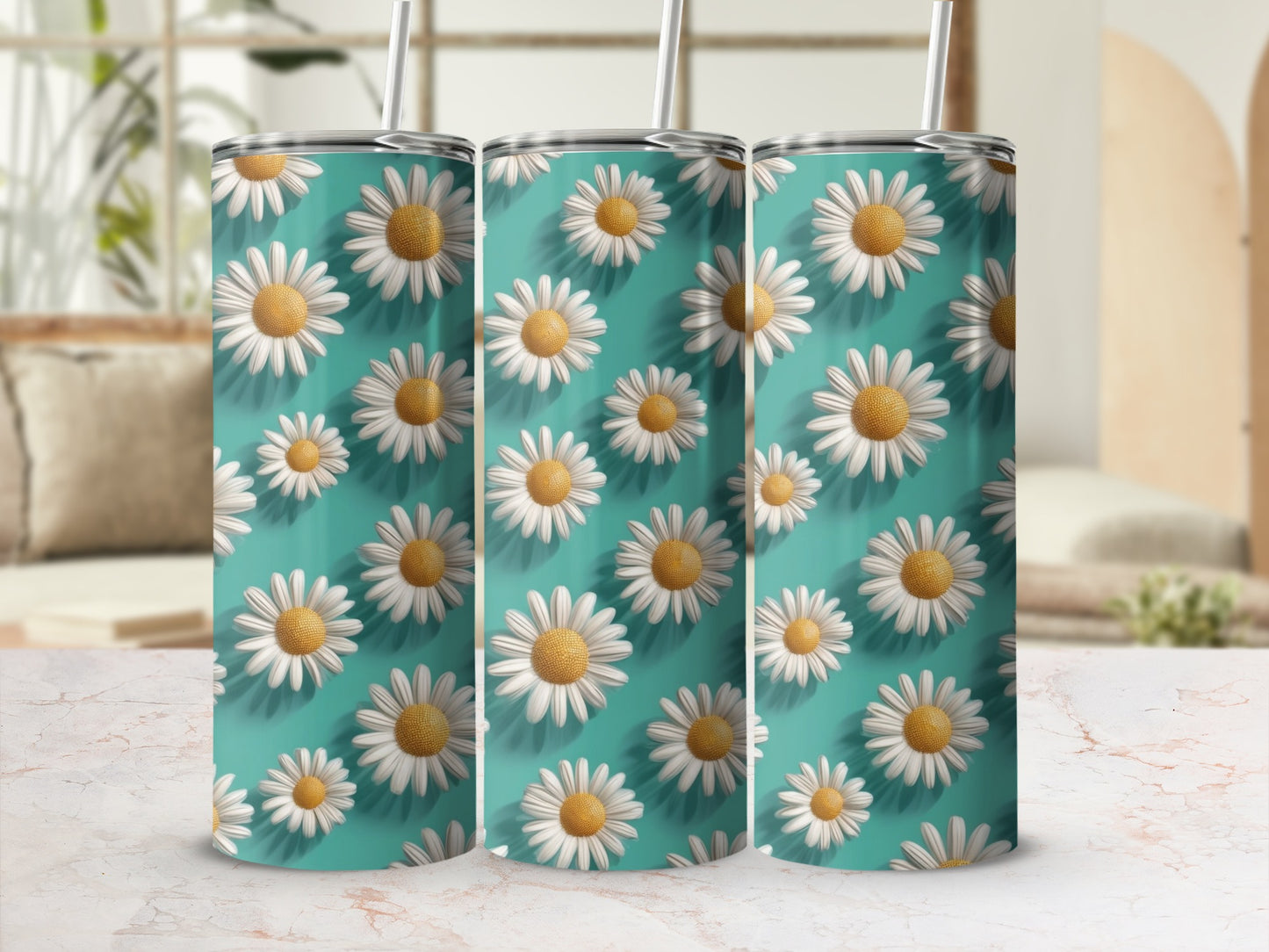 Three teal tumblers with repeating daisy pattern and white straws.