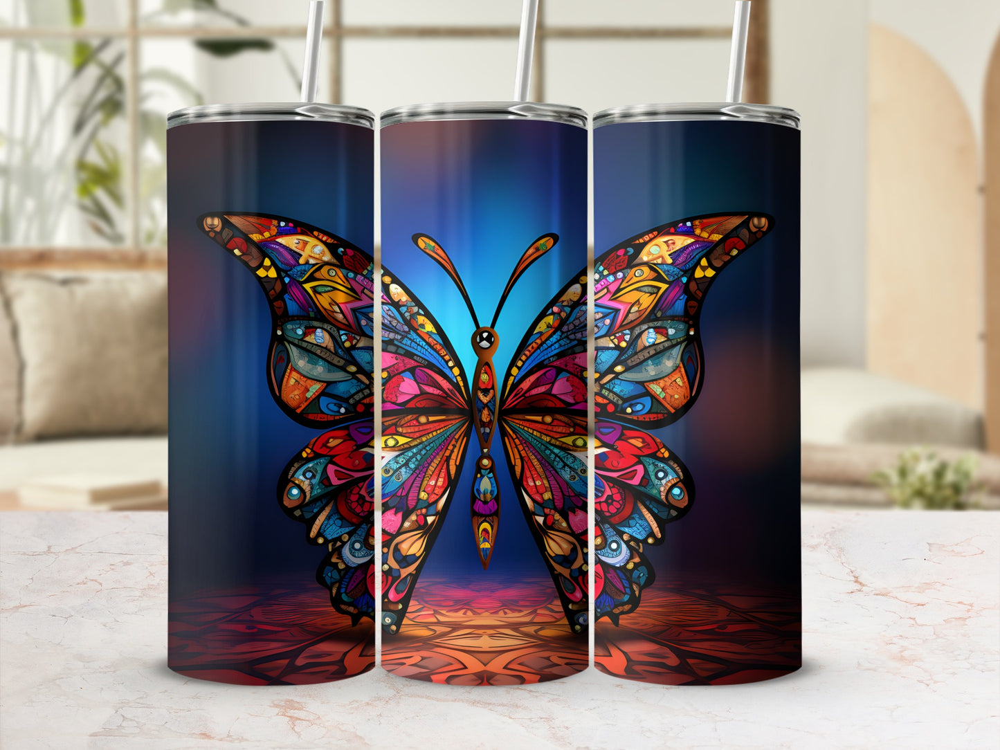 Colorful butterfly design on a tall, insulated tumbler with straw.