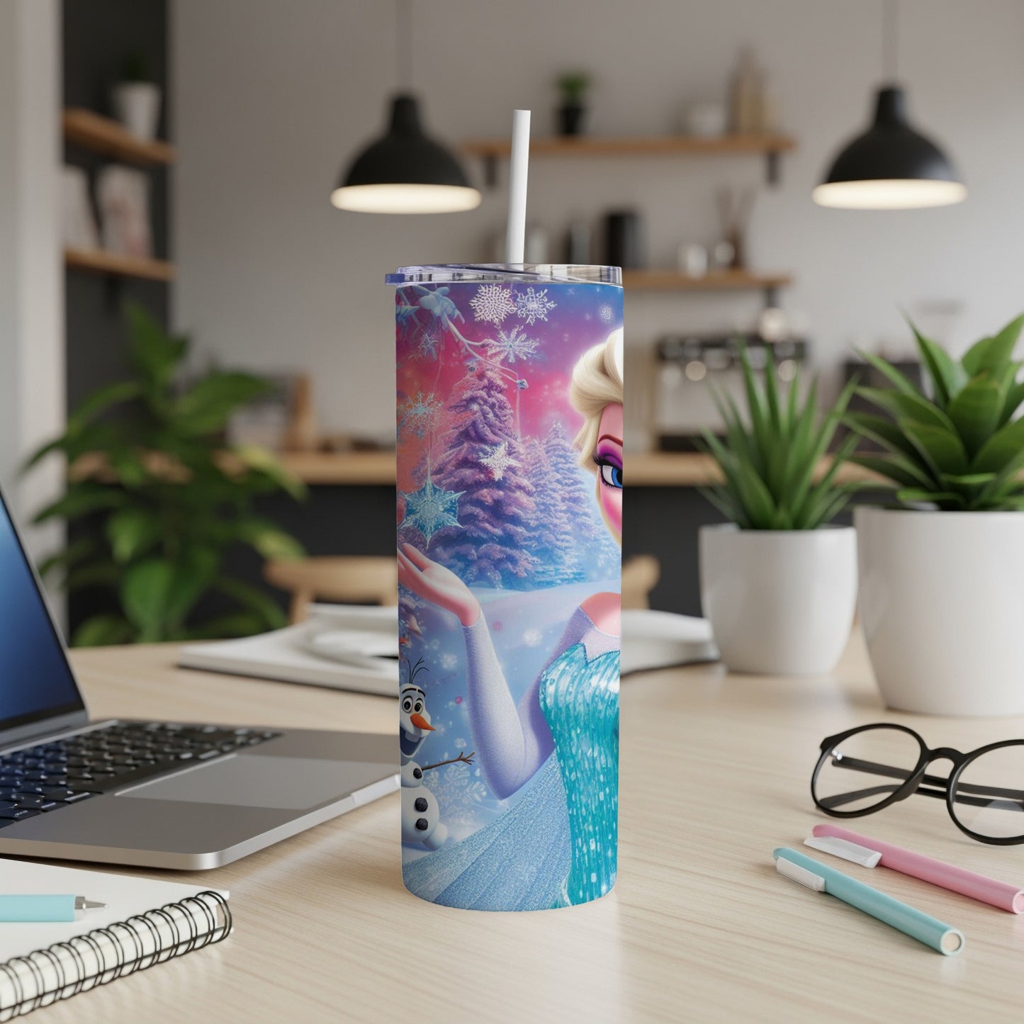 Elsa from Frozen on a tumbler with snowflakes and pine trees.