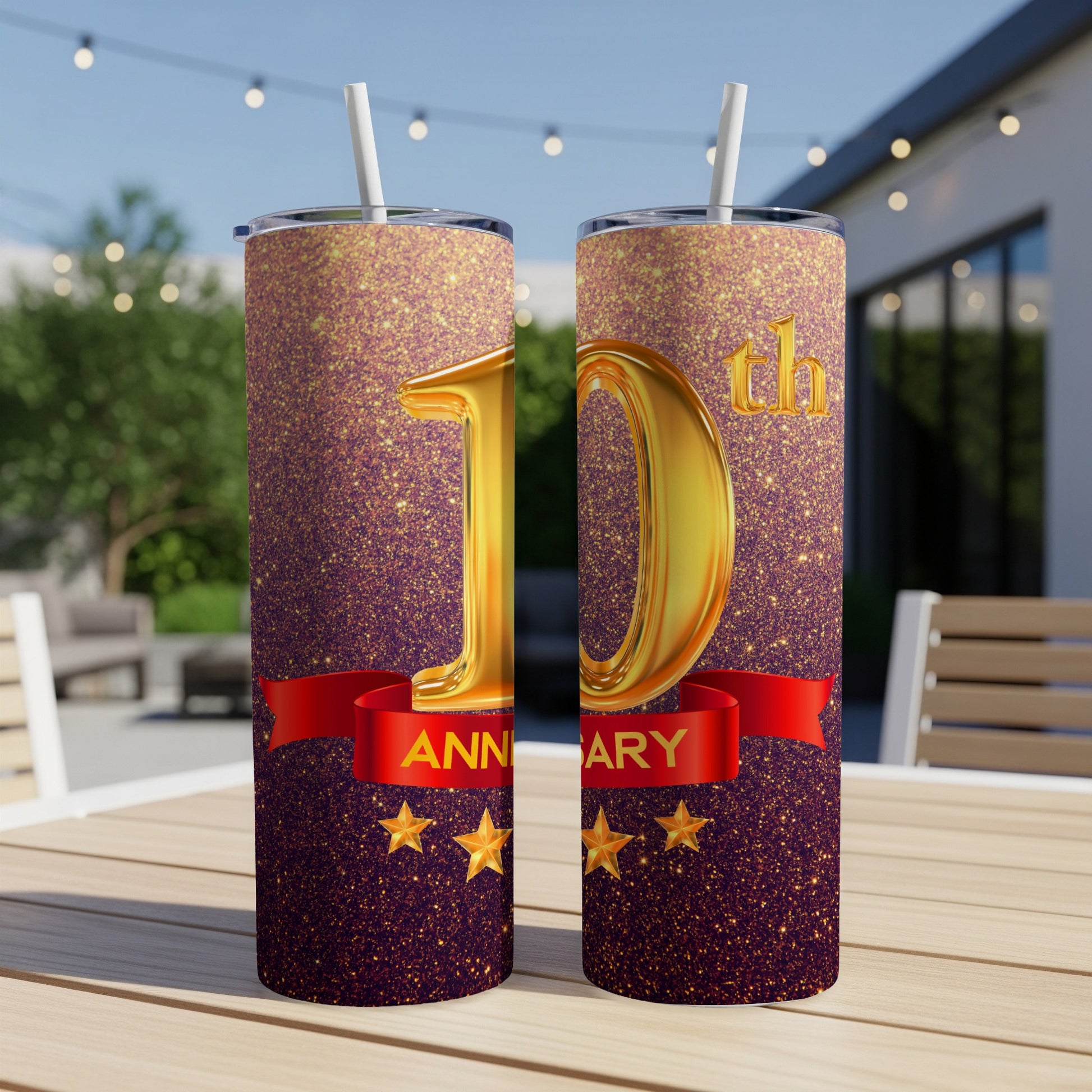 Gold "10th Anniversary" text on a glittery tumbler with stars and a red ribbon.