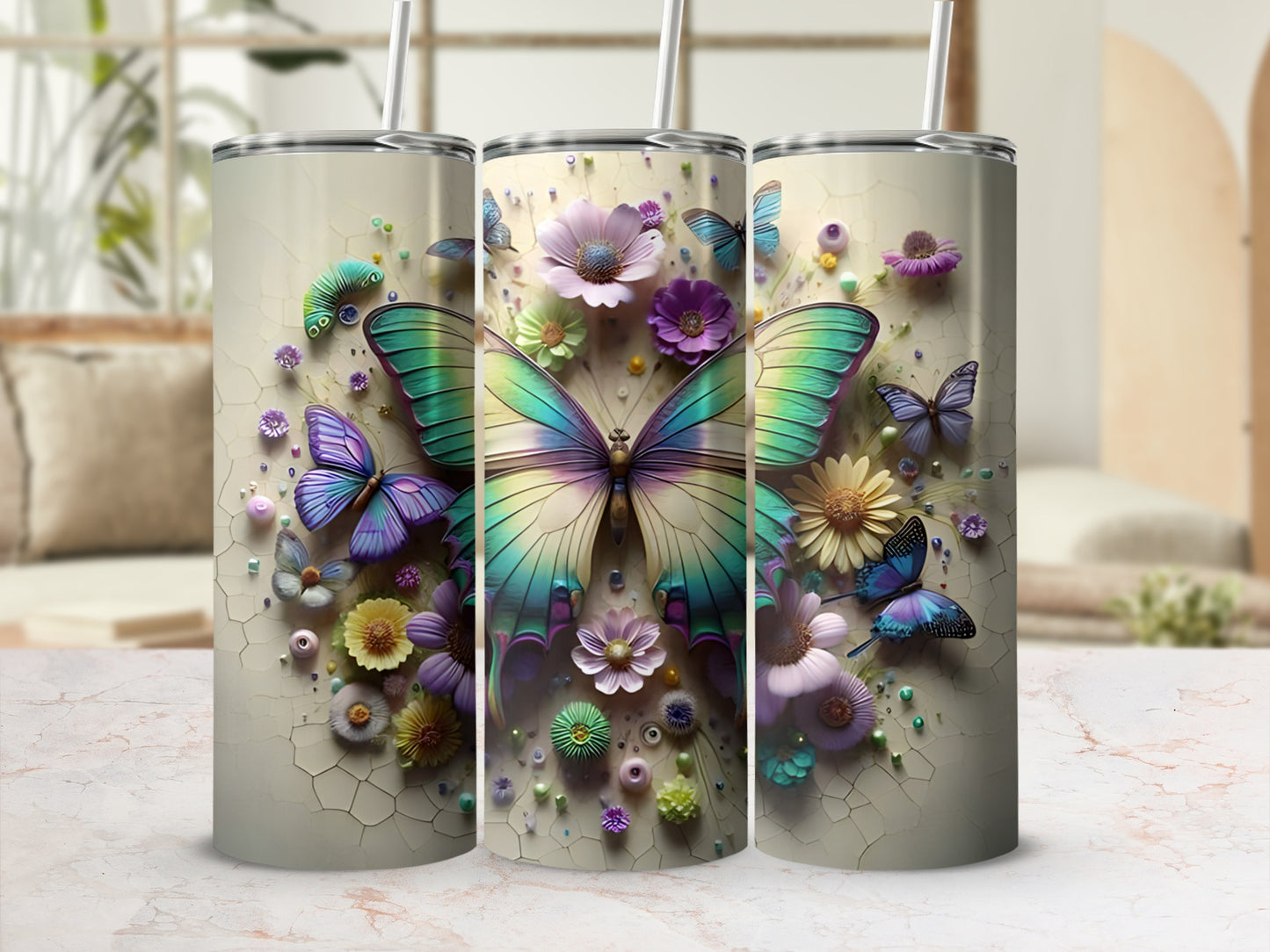 Three tumblers with iridescent butterflies and floral designs.