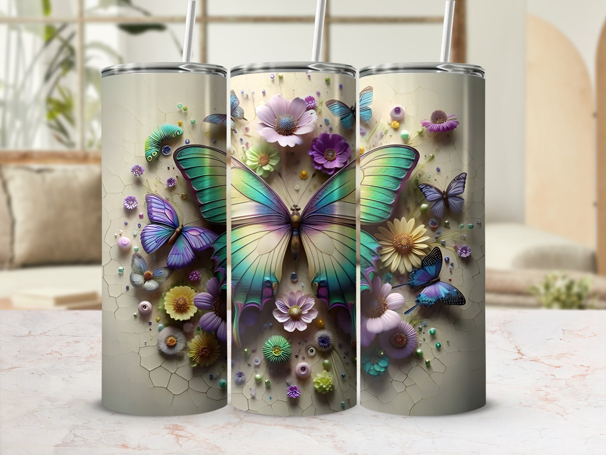 Three tumblers with iridescent butterflies and floral designs.