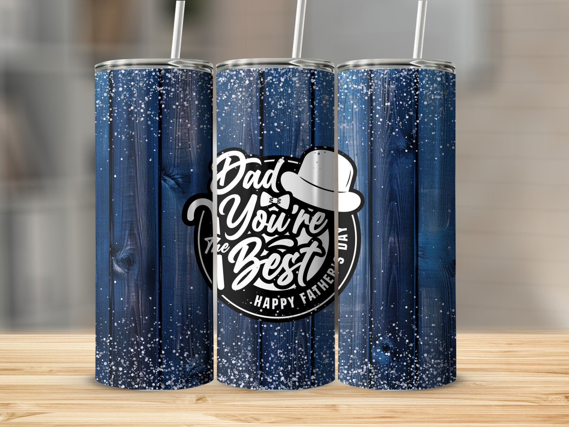 Three tumblers with blue wood grain and glitter design, featuring "Dad You're the Best" text.