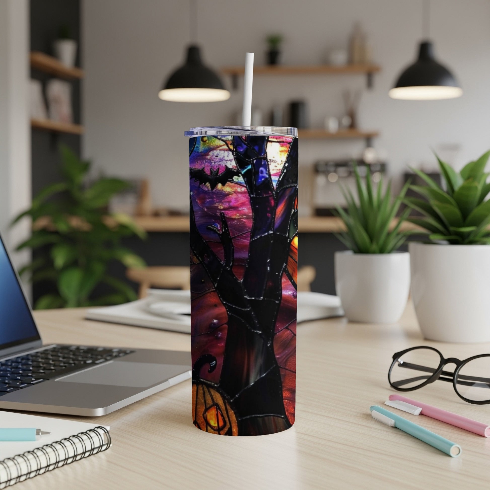Stained glass tumbler with Halloween scene, bat, pumpkin, and tree.