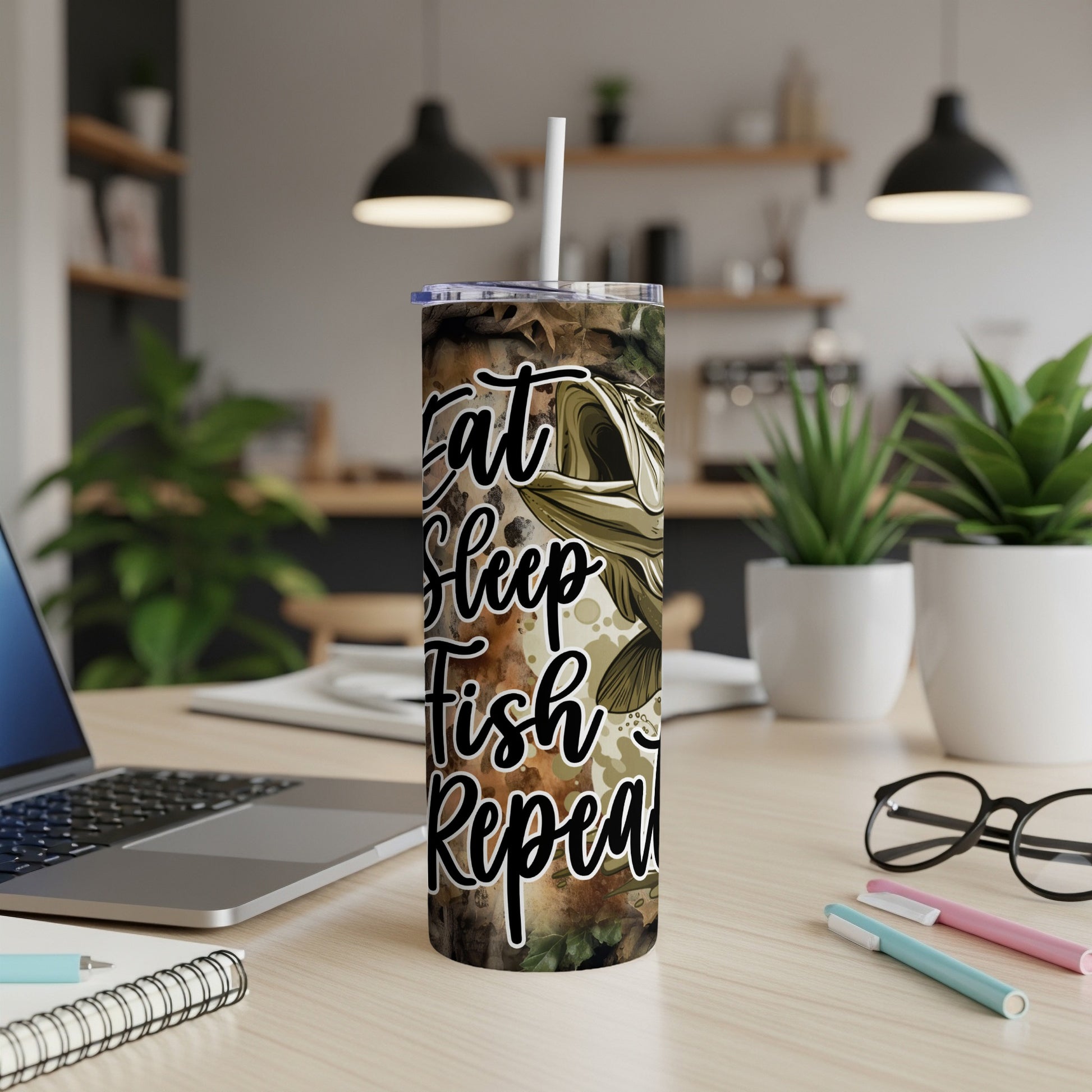 Camouflage tumbler with "Eat Sleep Fish Repeat" text and a fish graphic.