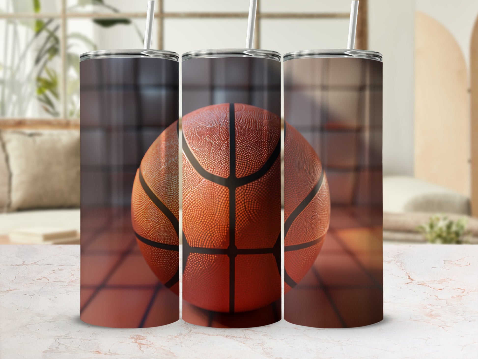 Three basketball tumblers with basketball pattern, one in focus.