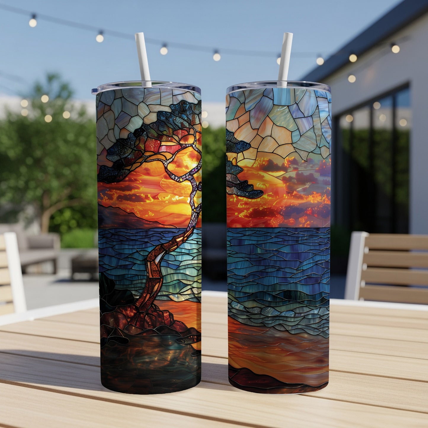 Two tumblers with stained-glass-style tree and sunset art.