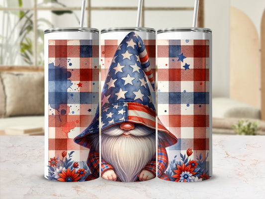 Gnome with patriotic hat and plaid shirt surrounded by flowers.