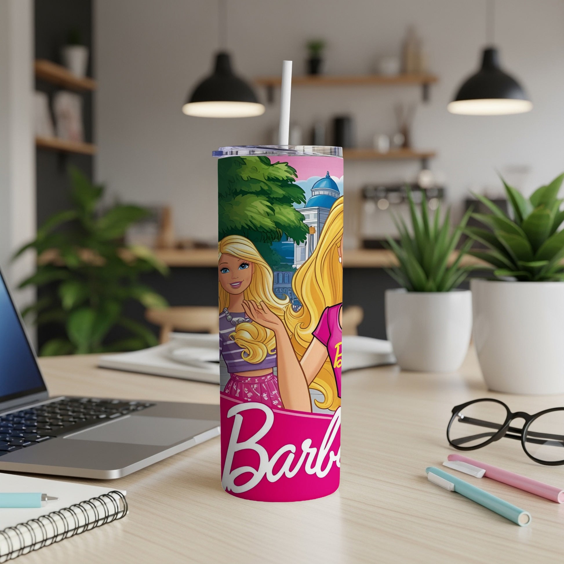 Pink tumbler with Barbie artwork and a white straw.