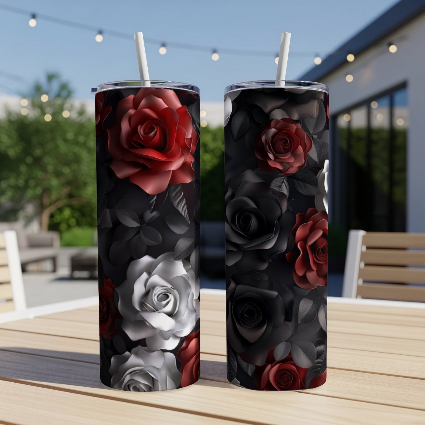Two tall tumblers with red, white, and black roses on a dark background.