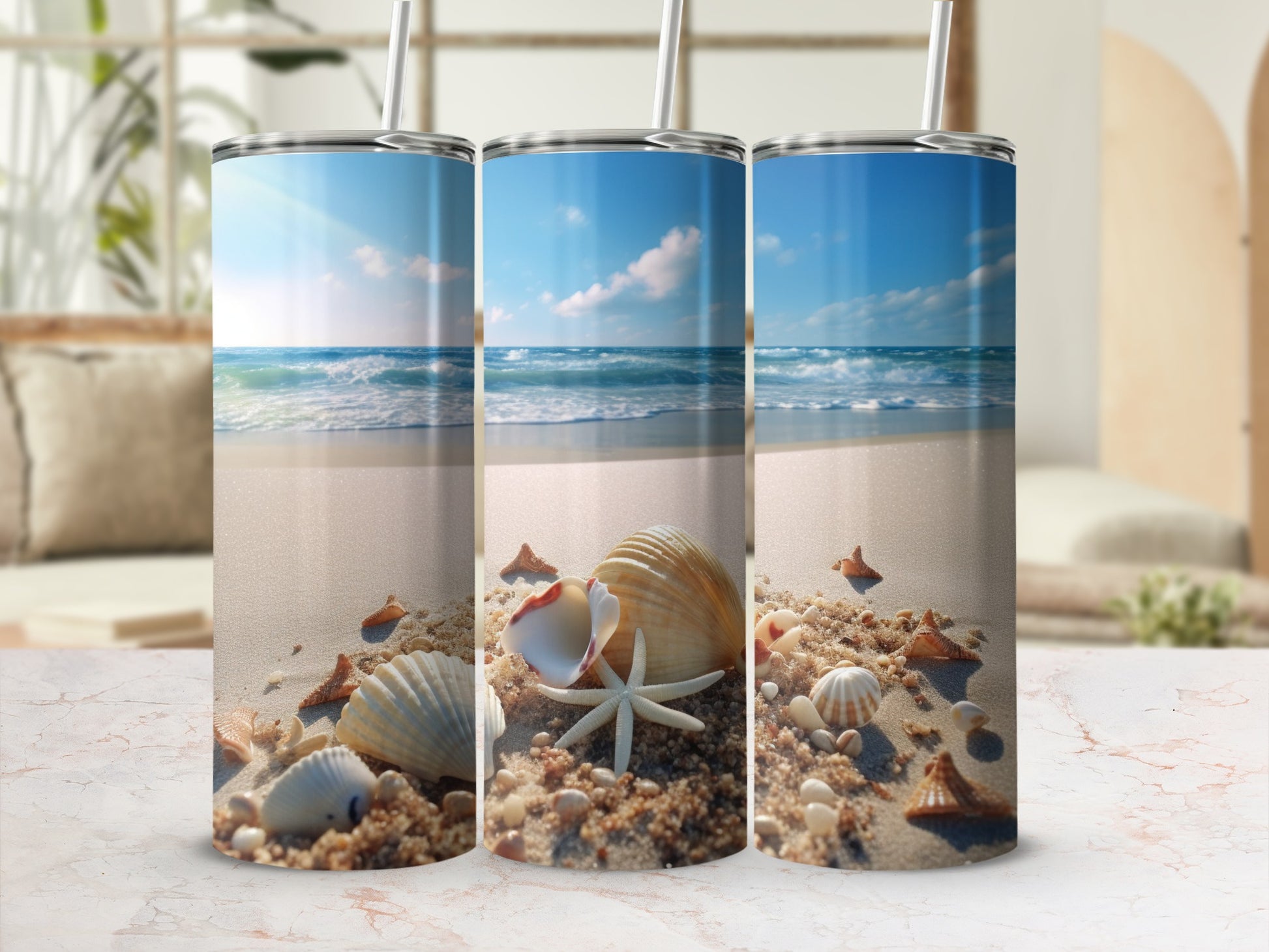 Three tumblers showing a beach scene with shells and starfish.