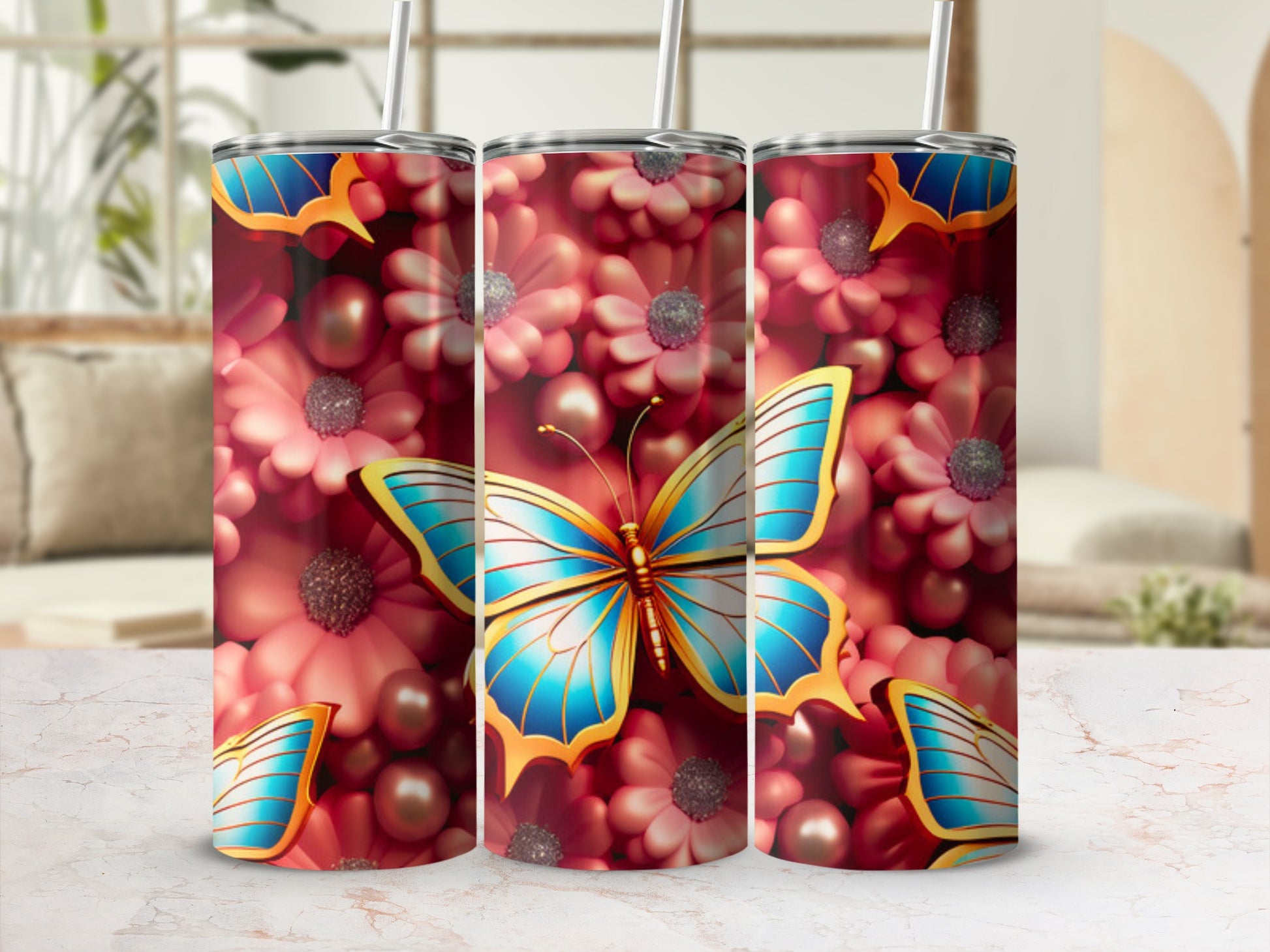 Three tumblers featuring a blue butterfly and pink flowers.